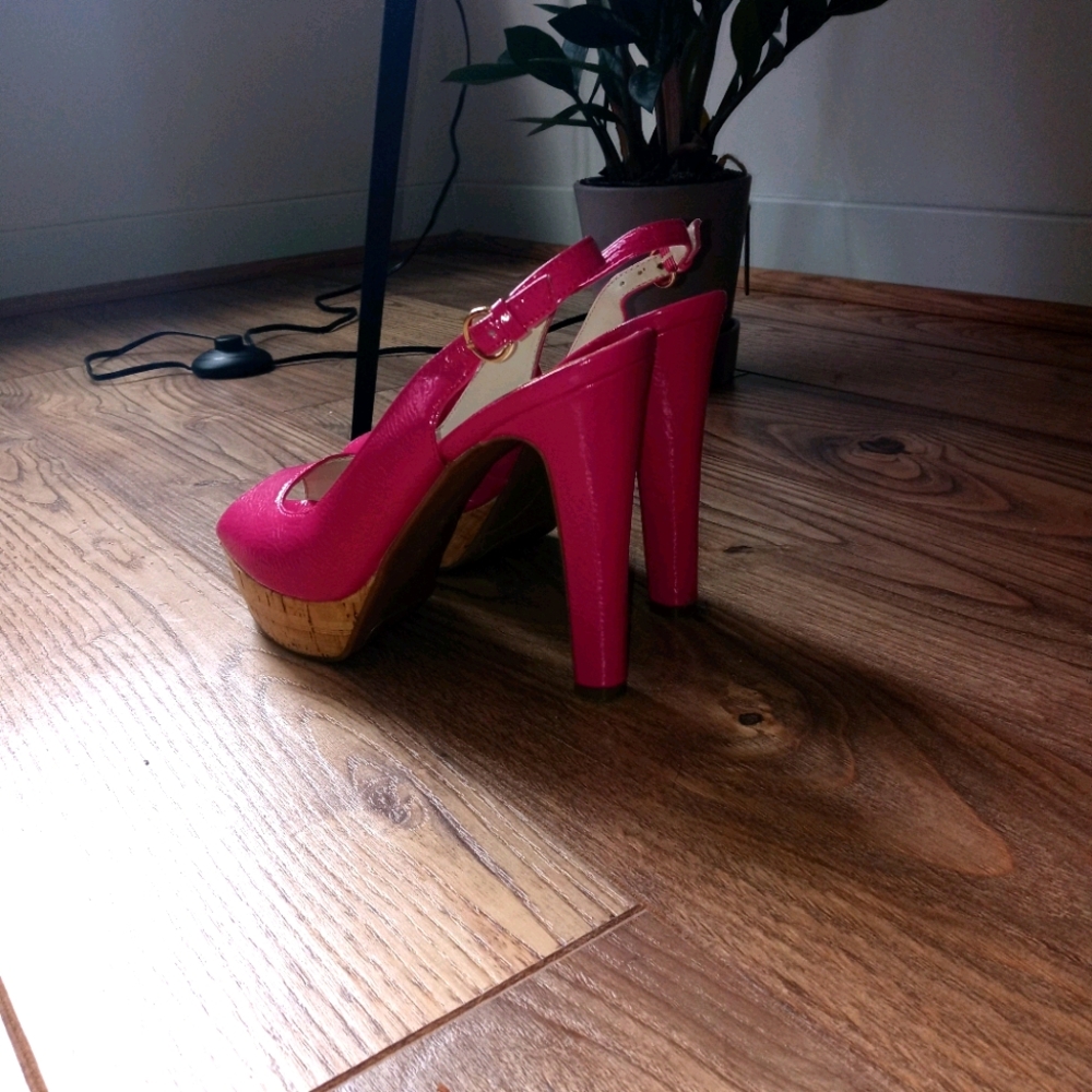 Hot pink high heeled shoes